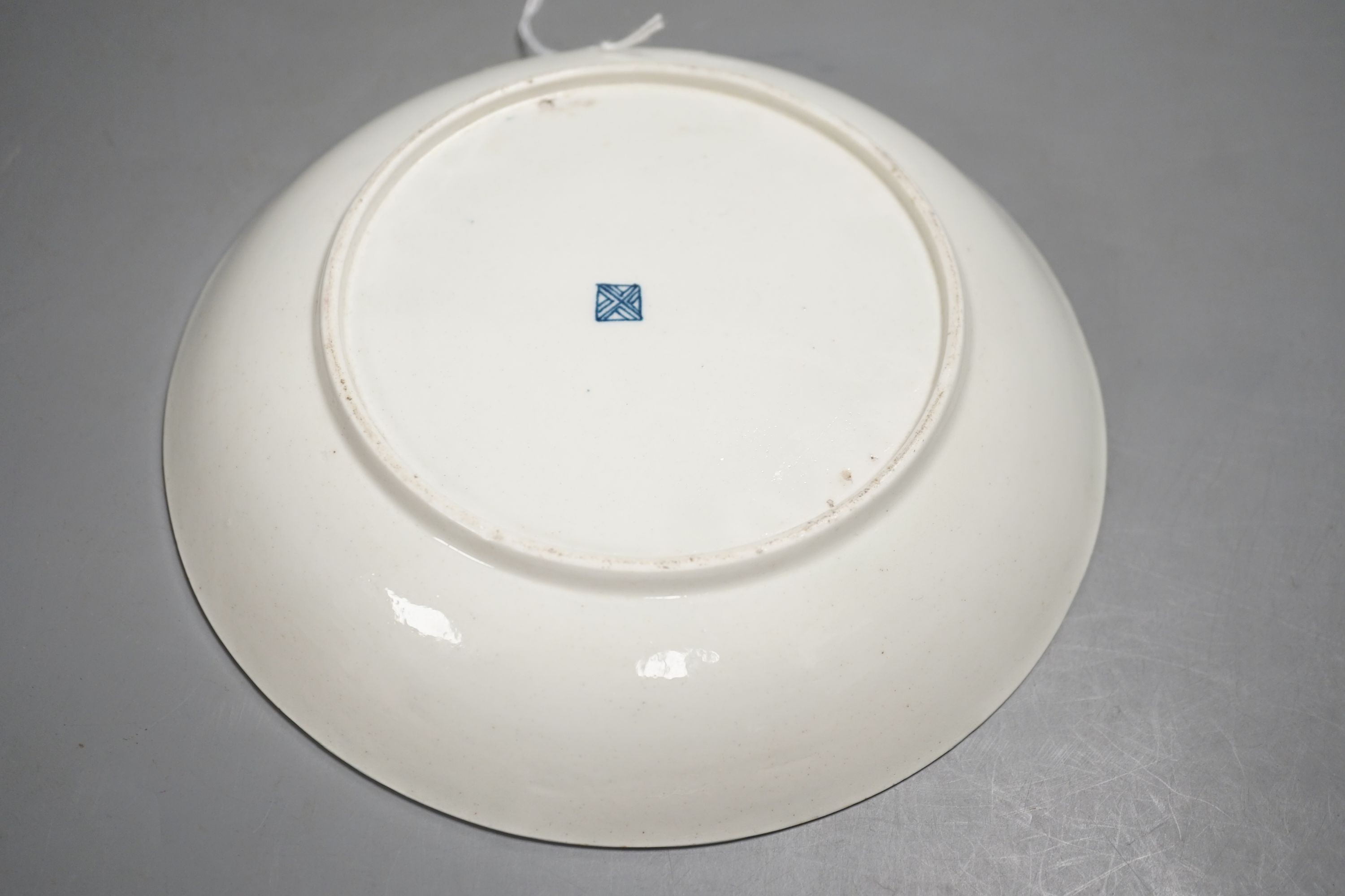 A Worcester saucer shaped dish painted with the blue panelled version of the Sir Joshua Reynolds pattern c.1765-70, 19cm